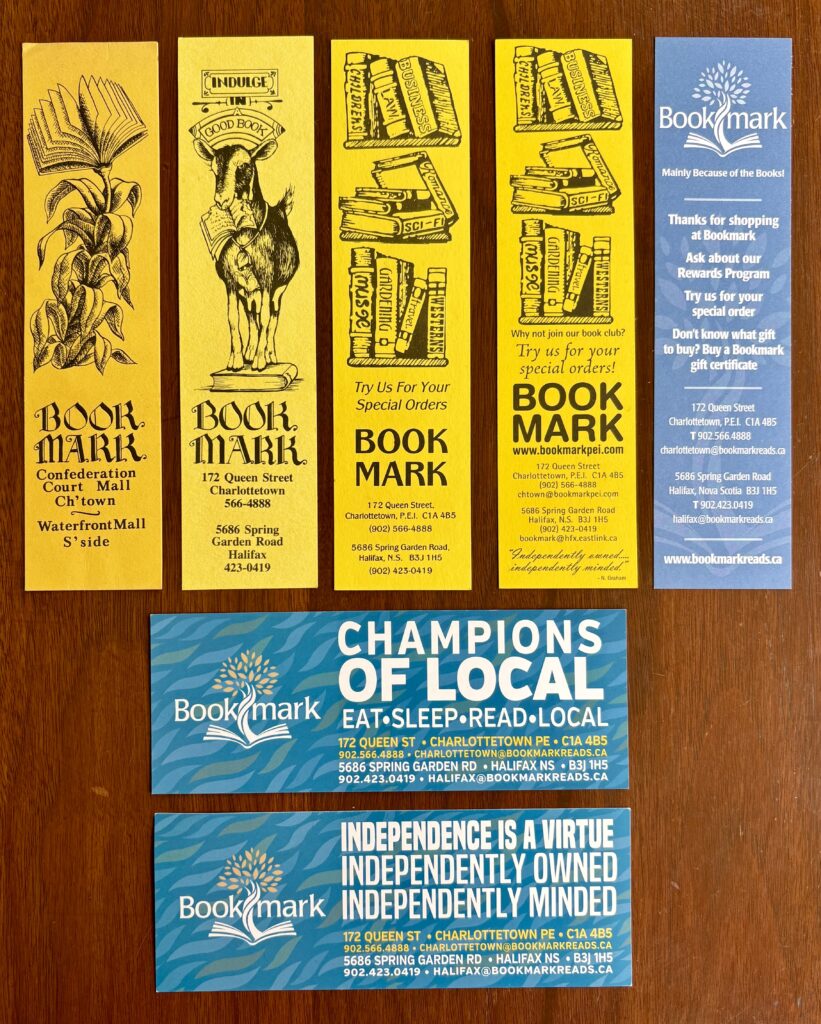 A series of yellow and blue bookmarks from a Charlottetown, PEI, store called Bookmark. The oldest one would likely be from the early 1980s and the most recent from a couple of years ago.